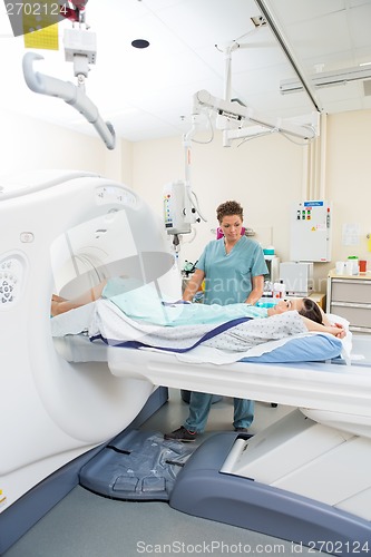 Image of Nurse Preparing Patient For CT Scan