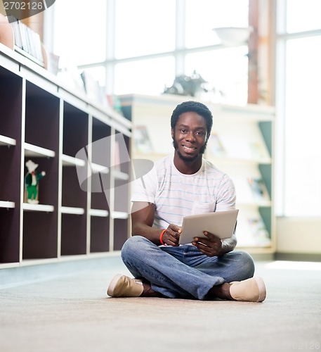 Image of Confident Student With Digital Tablet In Library