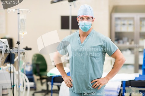 Image of Surgeon With Hands On Hips In Operation Room