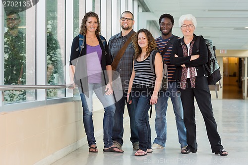 Image of Portrait of Professor with Grad Students