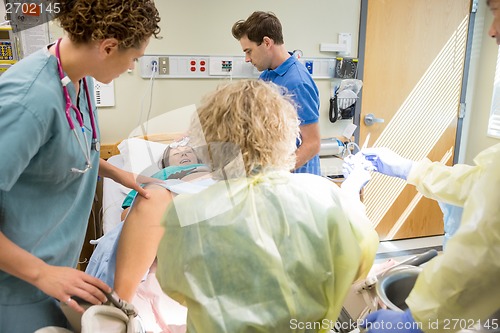 Image of Woman Giving Birth in Hospital