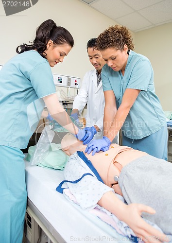 Image of Medical Team Performing CPR On Dummy