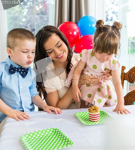 Image of Family Celebrating Girl's Birthday