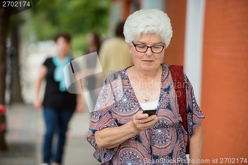 Image of Senior Woman Messaging On Smartphone