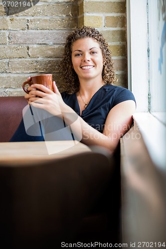 Image of Happy Woman With Coffee Mug In Cafe