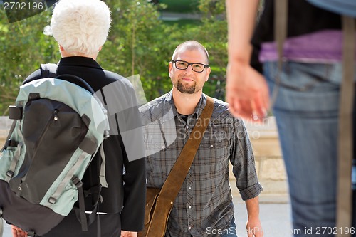 Image of Confident Student Walking On College Campus