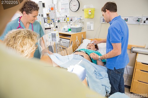 Image of Pregnant Woman Delivering a Baby in Hospital