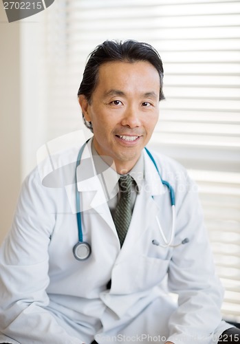 Image of Male Cancer Specialist Sitting In Hospital