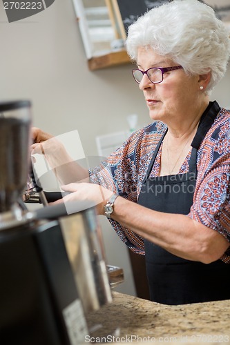 Image of Barista Preparing Espresso in Cafe