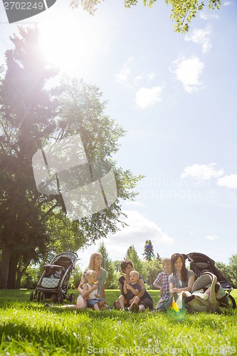 Image of Mothers And Children Spending Quality Time In Park