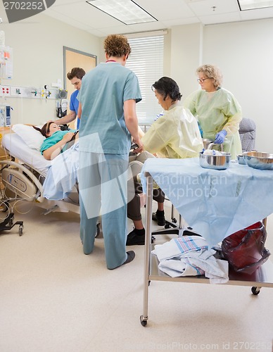 Image of Medical Team Delivering Baby in Hospital