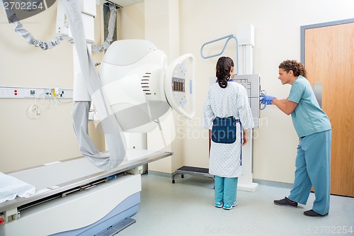 Image of Nurse Adjusting Xray Machine For Patient