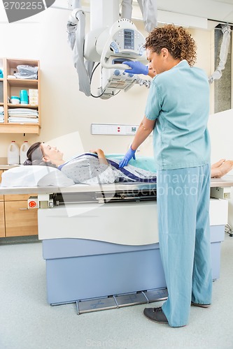 Image of Nurse Adjusting Xray Machine For Patient