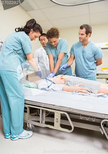 Image of Medical Team Performing CPR On Dummy Patient