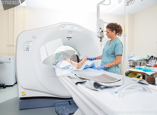 Image of Nurse Preparing Patient For CT Scan