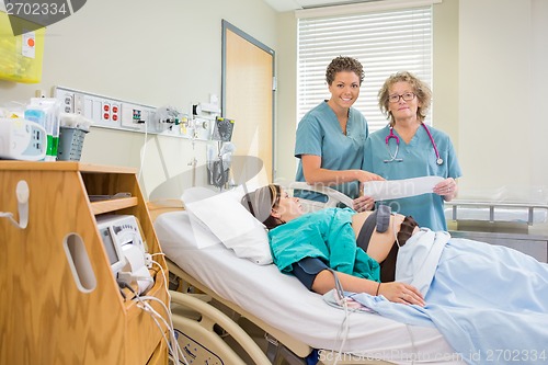 Image of Nurses in Maternity Ward Looking at Camera