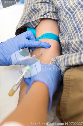 Image of Doctor Drawing Blood For Test