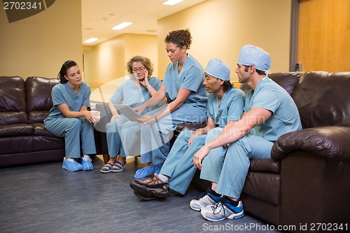 Image of Medical Team Using Digital Tablet In Hospital's Waiting Room