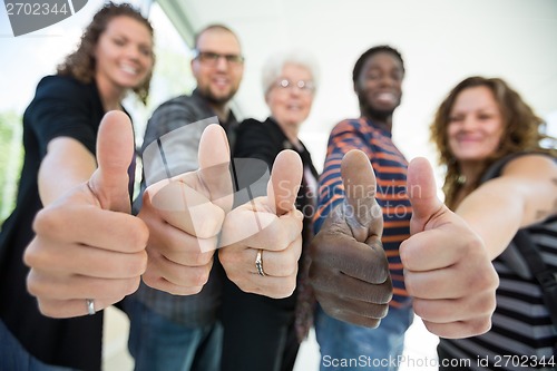 Image of Multiethnic University Students Gesturing Thumbsup