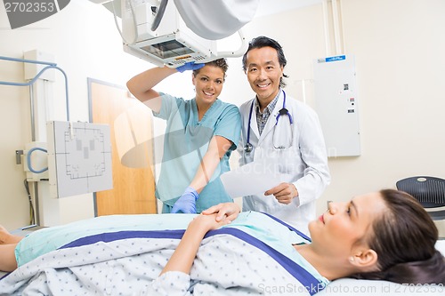 Image of Medical Team With Patient In Xray Room