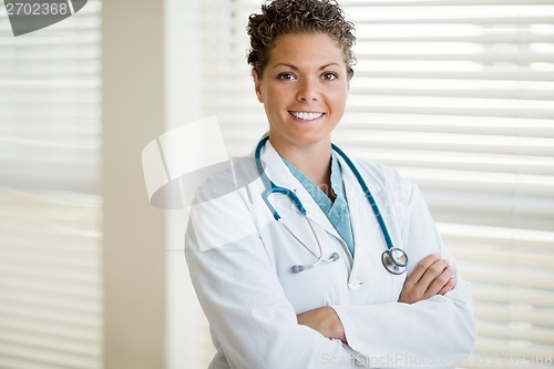 Image of Confident Cancer Specialist Standing Arms Crossed In Clinic