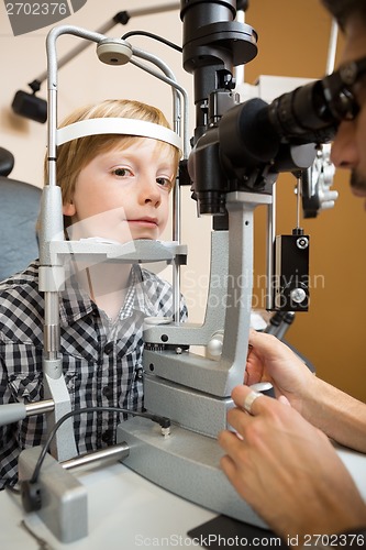 Image of Boy Having His Eye Tested With Slit Lamp By Doctor