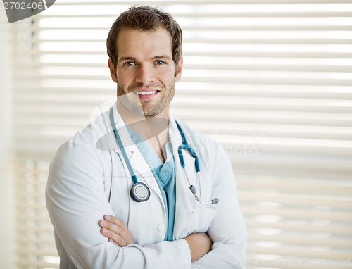 Image of Confident Male Doctor With Arms Crossed