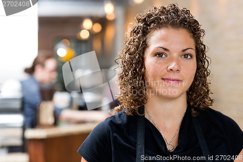 Image of Confident Female Owner At cafe