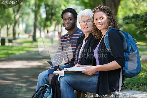 Image of Multiethnic University Students Sitting On Campus