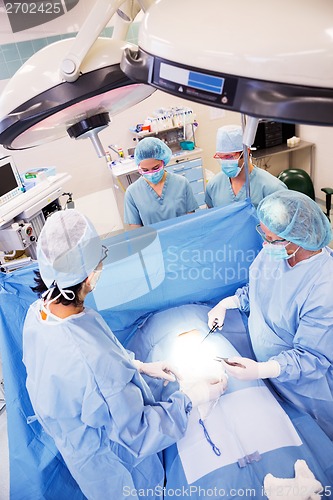 Image of Surgeons Operating in Surgical Theater