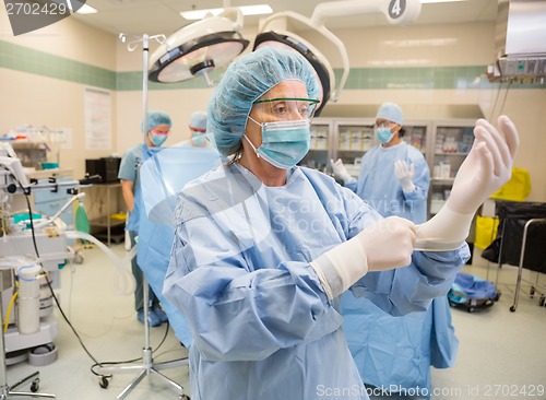 Image of Female Surgeon in Operating Theater