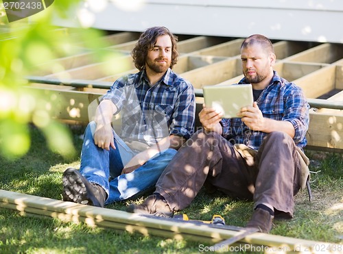 Image of Manual Workers Using Digital Tablet