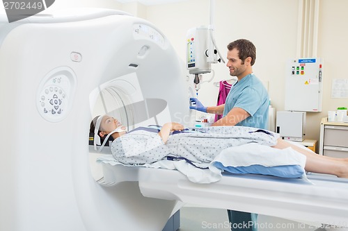 Image of Nurse Preparing Patient For CT Scan In Hospital