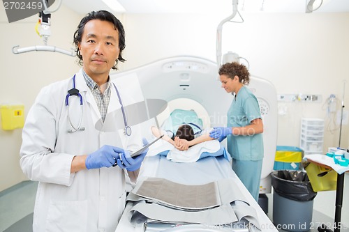 Image of Medical Team Preparing For CT Scan