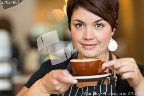 Image of Beautiful Barista Holding Coffee Cup