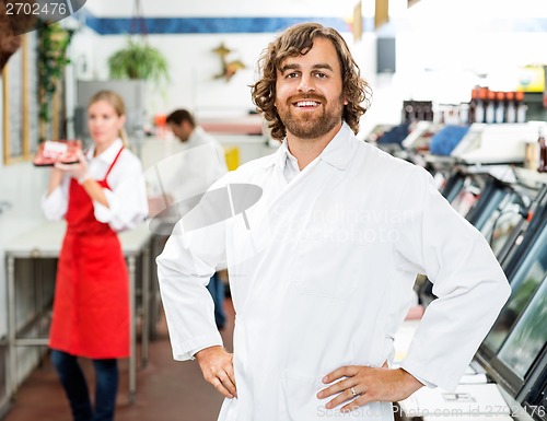 Image of Portrait Of Confident Butcher Standing At Store