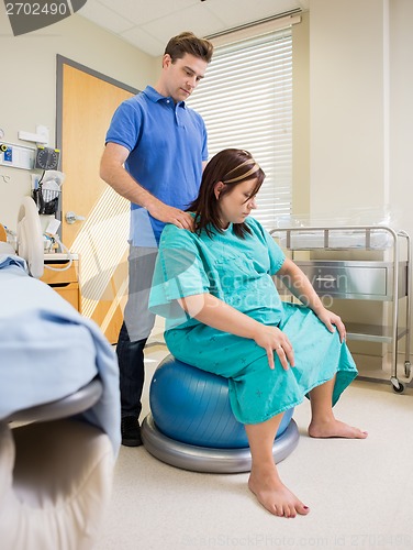 Image of Pregnat Woman in Hosptail Using Exercise Ball