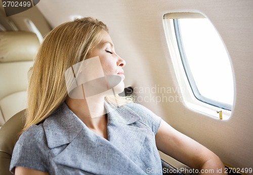 Image of Businesswoman Sleeping In Private Jet