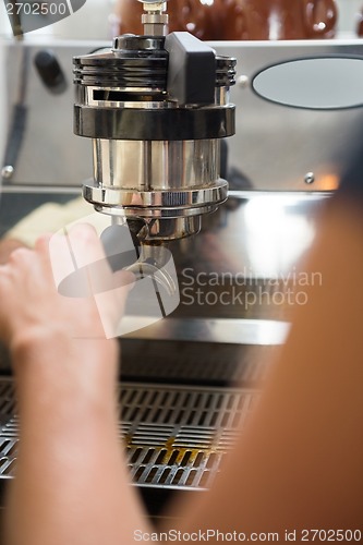 Image of Barista With Portafilter Making Coffee