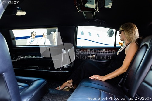 Image of Woman In Limousine At Airport Terminal