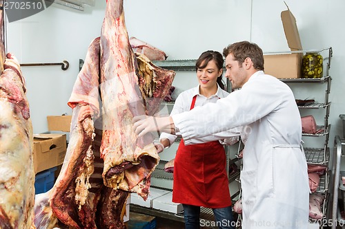 Image of Butchers Inspecting Beef