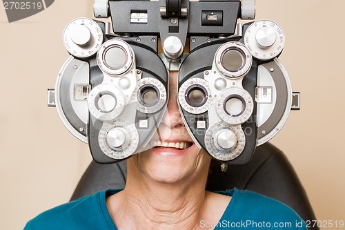 Image of Happy Woman Having An Eye Test