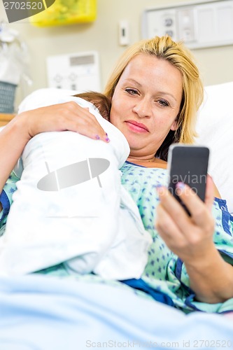 Image of Woman Taking Self Portrait With Babygirl Through Smart Phone
