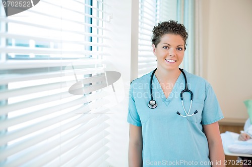 Image of Confident Female Nurse With Stethoscope Around Neck