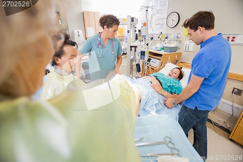 Image of Woman Giving Birth in Hospital