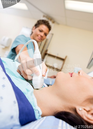 Image of Patient Undergoing Ultrasound Of Thyroid Gland