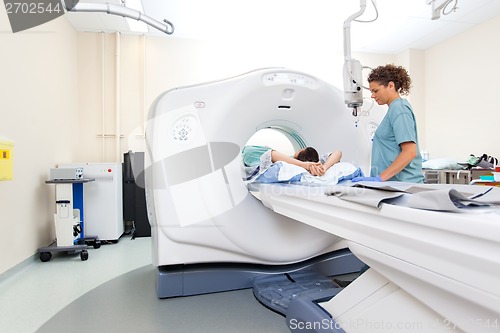 Image of Nurse Preparing Patient For CT Scan Test