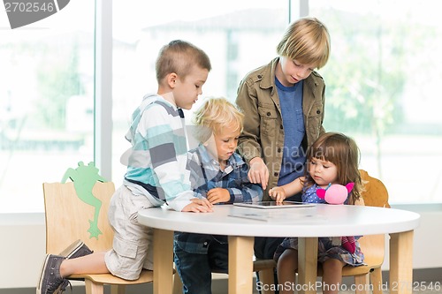 Image of Students Using Tablet Computer In Library