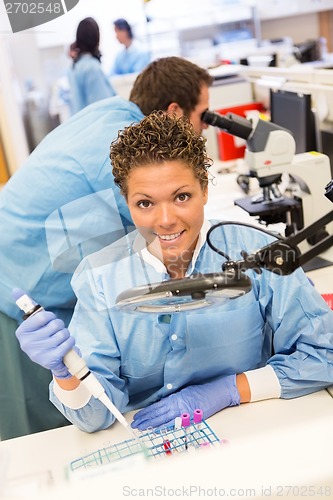 Image of Female Researcher Working In Laboratory