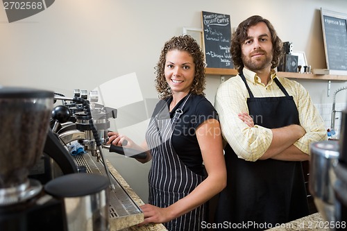 Image of Confident Workers At Counter In Coffeeshop